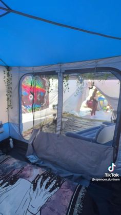 the inside of a tent with an air mattress