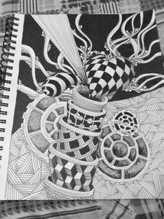 a black and white drawing of a vase