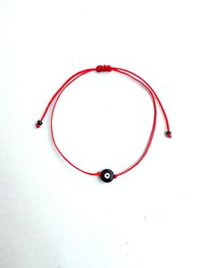 The black evil eye brings good luck,power and protection from envious people. This simple yet beautifull bracelet is made using durable black waxed string and has a glass beed evil eye charm in the middle,and black seed beads at the ends. The diameter of the flat eye bead is 7mm approx. It is adjustable with a sliding knot closure. -It is advisable to use this bracelet on children over 3 years,since it contains small beads... Other evil eye bead bracelets from my shop: https://www.etsy.com/shop/ Black Spiritual Friendship Bracelets With Evil Eye, Spiritual Black Friendship Bracelets With Evil Eye, Spiritual Black Evil Eye Friendship Bracelets, Spiritual Black Friendship Bracelet With Evil Eye, Black Evil Eye Bracelet With Sliding Knot As Gift, Black Evil Eye Bracelet, Black Evil Eye, Sliding Knot Closure, Small Beads