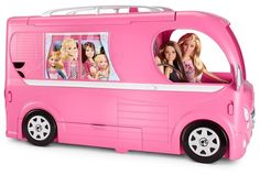 a pink toy bus with pictures on the side