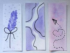 three handmade bookmarks with different designs on them, one is purple and the other is white