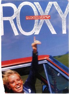 the cover of roxy magazine shows a woman holding up her hand in front of a red car