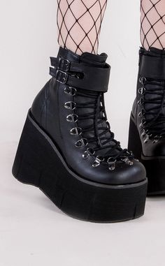 The Kera series features an impressive platform wedge across a range of styles to suit everyone who wants to tower over the competition. Vegan Black PU leather 4 1/2 inch platform Ankle buckle Lace up Side zip U.S women's sizing-refer to size chart for more info Botas Grunge, Rave Boots, Platform Shoes Boots, Demonia Boots, Alternative Shoes, Goth Shoes, Demonia Shoes, Gothic Shoes, Black Platform Shoes