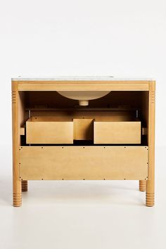 a wooden table with drawers and a white background