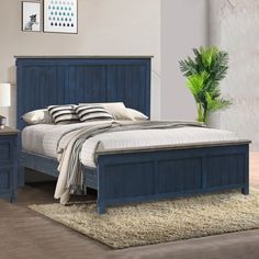 a bedroom with a bed, night stand and nightstands on carpeted flooring