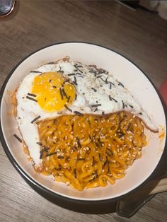 an egg and rice dish on a white plate