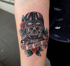 a tattoo on the arm of a person with a darth vader helmet