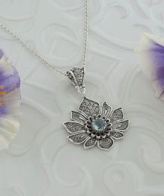 Blue Topaz Silver Spiritual Lotus Victorian Pendant Necklace, 925 Sterling Silver Handmade Filigree Yogi Floral Jewelry, Flower Pendant Birthday gift, Anniversary gift, november pendant, gift for mom, blue daisy pendant, handmade pendant Material: 925 Sterling Silver ( NICKEL FREE ) Gemstone: Sky Blue Topaz 6 mm (Round-cut) -The stone used in this jewelry, Blue Topaz Gemstone, is the November Birthstone. Make a statement when you wear our topaz silver spiritual lotus pendant necklace. At the heart of this pendant is a faceted amethyst stone and looks like an ancient flower with that gem. This pendant is made of 925 sterling silver and has been oxidized by our master. Chain Length:  -21 Inches ( 53 cm ) -18 Inches + 2 Inches Extender ( 46 cm + 5 cm Extender ) Pendant height and width: -1.75 Luxury Spiritual Filigree Jewelry, Luxury Blue Flower Pendant Jewelry, Silver Blue Topaz Necklaces For Wedding, Silver Blue Topaz Necklace For Wedding, Victorian Pendant Necklace, Daisy Pendant, Pretty Jewelry Necklaces, Lotus Pendant, Victorian Pendants