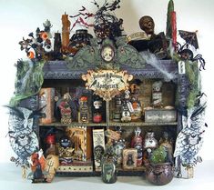 a shelf with many halloween decorations on it