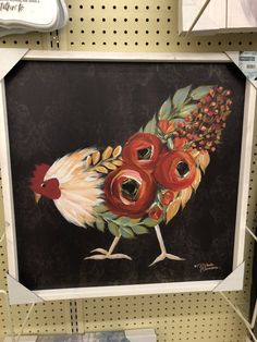 a painting of a rooster with red flowers on it's head in a store