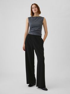 Soft stretch pull-on pants.  Elasticized waist.  Front slant pockets, back welt pockets.  Seam at front and back.  Fit: Classic.  An easy silhouette that fits close  at the waist, and is relaxed through the hips and thigh.  Mid rise.  Models wearing Gap Flattering Pants For Thick Thighs, Pants For Thick Thighs, Easy Silhouette, Flattering Pants, Toddler Jeans, Brand Collaboration, Pull On Pants, Men Boys, Model Poses