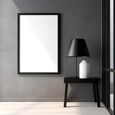 a black table with a lamp and a white vase on it in front of a gray wall