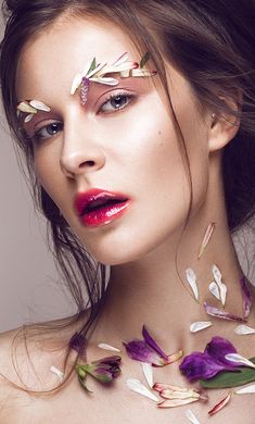 a woman with flowers all over her face