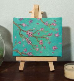 a small easel with a painting on it