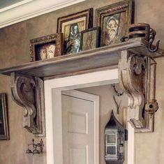 an entry way with pictures on the wall