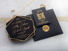 a black and gold wedding suite with a monogrammed seal on the front, and a qr code on the back