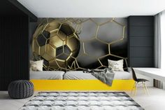 a bedroom decorated in black and gold with a soccer ball on the wall