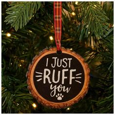 a wooden ornament hanging from a christmas tree that says i just ruff you