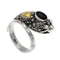 Made Sriasih conjures the mystic allure of the dragon revered in Balinese legend. Centered with a black onyx cabochon this extravagant ring is fashioned of sterling silver. Applications of 18k gold add beauty to a novel design. .925 Sterling silver Luxury Black Filigree Ring, Ornate Black Sterling Silver Rings, Collectible Onyx Ring Jewelry, Black Onyx Gothic Rings, Luxury Hallmarked Onyx Rings, Nature Ring, Twist Ring, Square Rings, Wrap Rings