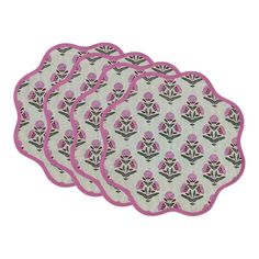 four placemats with pink flowers on them