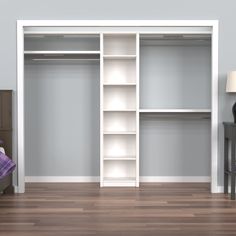 an empty bedroom with a bed and shelves