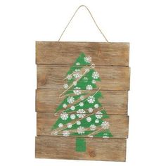 a wooden sign with a christmas tree painted on it