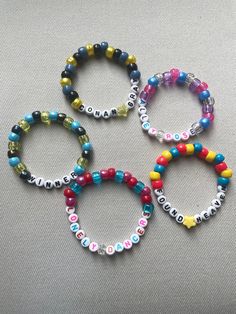 PLEASE READ FULL DESCRIPTION Let's trade friendship bracelets at Conan Gray's Found Heaven on Tour! Unique and high-quality bracelets for you to either wear or share during the concert. Keep what you love and trade what you don't! They're the perfect addition to any Found Heaven tour outfit! Randomly chosen for each order. No duplicates in an order. Customization possible upon request. Customization: let me know your favorite songs, album, phrases, inside jokes, or colors and I'll include a personalized mix for you! Bracelets are approximately between 6.5-7.5 inches but let me know if you would like them smaller or bigger sizes All bracelets are made with pony beads, letter beads and clear stretch cord. Designed for easy trading and swapping, but please be careful when pulling them on or o Concert Beaded Bracelets, Heathers Bracelets, Found Heaven Bracelet, Handmade Inspirational Bracelets For Friendship, Handmade Inspirational Friendship Bracelet, Handmade Inspirational Friendship Name Bracelet, Inspirational Handmade Friendship Name Bracelet, Customized Multicolor Adjustable Friendship Bracelets, Customized Multicolor Friendship Jewelry