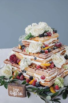 the cake is made with flowers and berries