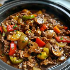 a close up of a stew in a crock pot