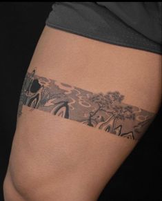 a person with a tattoo on their thigh