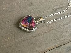 Tiny Mystic Topaz heart Necklace. Mystic Alexandrite Quartz pendant. Rainbow Quartz charm. Delcate jewelry. Sterling Silver necklace. Valentine day gift. Sterling Silver jewelry. Beautiful Mystic Topaz Sterling Silver Necklace. Vintage style statement. The pendant with jump ring measures 16 mm long and 11 mm wide. Also, I have the same pendants in slightly bigger size, 20 x 13 mm. Sterling silver chain is 16 inches long on a mannequin. This gorgeous necklace comes in a complimentary, beautiful j Valentine Day Gift, Rainbow Quartz, Jewelry Beautiful, Jewelry Sterling Silver, Mystic Topaz, Studio City, Necklace Vintage, Quartz Pendant, Style Statement