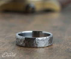 a close up of a wedding ring on a table