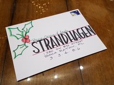 a christmas card with the words, straddlingen and holly berries on it