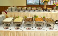 a buffet table filled with lots of food