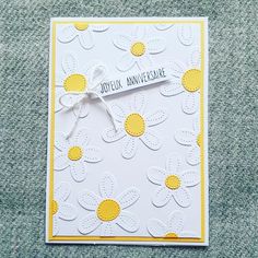 a card with yellow and white flowers on it