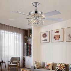 a living room filled with furniture and a ceiling fan