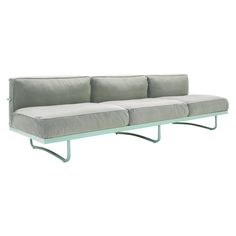 a gray couch sitting on top of a metal frame