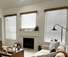 a living room filled with furniture and a fire place