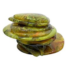 a stack of green plates sitting on top of each other