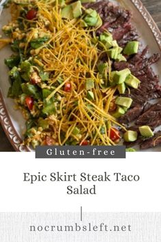 a white plate topped with steak and salad