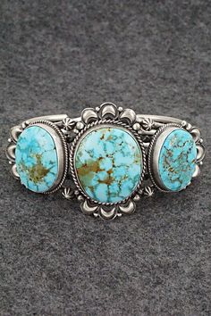 "This stunning Kingman turquoise and sterling silver bracelet was made by Navajo silversmith Derrick Gordon. The back is signed Derrick and stamped Sterling. Size: 5 1/2\" (will fit up to a 6 3/8\" wrist) Gap: 7/8\" Length: 1 5/8\" Free shipping on all orders! We ship with USPS and always include tracking. All orders ship within a day of payment. Returns are accepted up to 30 days after you receive your order. Just send us a message. Our shop offers cash back or store credit. The item must be re Real Turquoise Jewelry, Silver Turquoise Jewelry, Turquoise Jewelry Native American, Gold Rings Fashion, Navajo Jewelry, Rings Fashion, Authentic Jewelry, Turquoise Rings, Kingman Turquoise