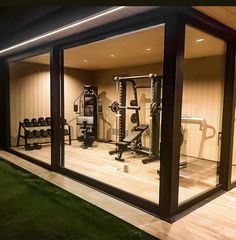 an indoor gym is lit up at night