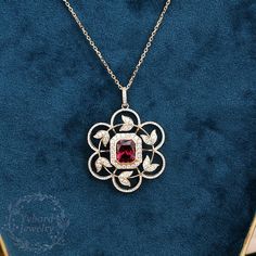 "Jewelry Details -Gold Type : Solid 14k gold -Center Stone: NATURAL Garnet 7.5*9mm, Approximately 3.8ct Color: 3A Clarity: VS Cut: Emerald Cut / 3EX -Side Stone: 0.18cttw moissanite Color: DEF Clarity: VVS1 Cut: Round Cut / 3EX -Pendant Width: 14mm -Pendant Height: 23mm Chain Length: 40+2+3cm SKU: YP0046 ~*-*~Purchase Guarantee: - All our jewelry is handmade, and each process is refined. - 14 Day Refund Guarantee. - All our products are Free Shipping. - Free Gift Box&Packing. ~*-*~Please con Red Gem Pendant, Antique Garnet Pendant Necklace, Vintage Red Garnet Necklace, Luxury Garnet Pendant Necklace, Faceted Garnet Red Necklace, 14k Yellow Gold Necklace, Garnet Pendant, Wedding Bridal Jewellery, Red Gemstones