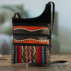 This compact sling bag with multiple compartments is an ideal travel companion. Kathiana Quispe in Peru crafts the bag from black suede, accenting it with a handloomed alpaca-blend textile and leather trim. The fully lined bag has a long adjustable strap that can be worn over the shoulder or cross-body. Mexican Shoes, Unique Handbag, Casual Ankle Boots, Luxury Crossbody, Saddle Blanket, Large Handbags, Leather Art, Boho Bags, Leather Projects