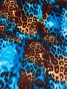 an animal print fabric with blue and brown colors