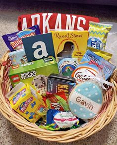 a basket filled with candy and snacks on the floor