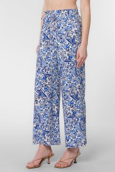 Looking for a fresh and fashion-forward look? These stylish pants feature a pull-on style, wide legs, an elastic drawstring waist, and side pockets. So whether you're dressing up or dressing down, these pants are sure to keep you looking your best. Material: 100% Viscose Machine wash cold, tumble dry low Color: Blue Paisley Model is 5'9" and wearing a size S Imported Paisley Print Vacation Bottoms, Vacation Paisley Print Long Pants, Paisley Print Long Pants For Vacation, Spring Relaxed Fit Bottoms With Paisley Print, Spring Paisley Print Trousers, Paisley Print Wide Leg Vacation Pants, Relaxed Fit Bottoms With Paisley Print For Spring, Paisley Print Trousers For Spring, Blue Paisley Print Bottoms For Vacation