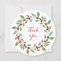 a thank card with holly leaves and red berries