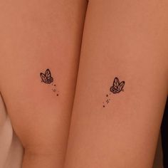 two small tattoos on the thighs of women's butts, both with butterflies