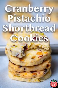 cranberry pistachio shortbread cookies are stacked on top of each other